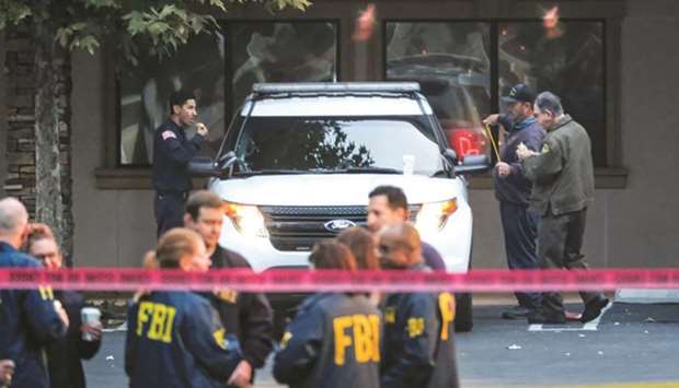 FBI agents are seen at the site of the shooting in Thousand Oaks.