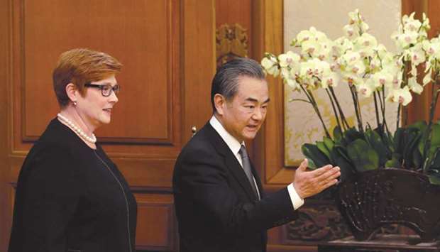 Australiau2019s Foreign Minister Marise Payne (left) and Chinau2019s Foreign Minister Wang Yi arrive for a news conference at the Diaoyutai State Guesthouse in Beijing.