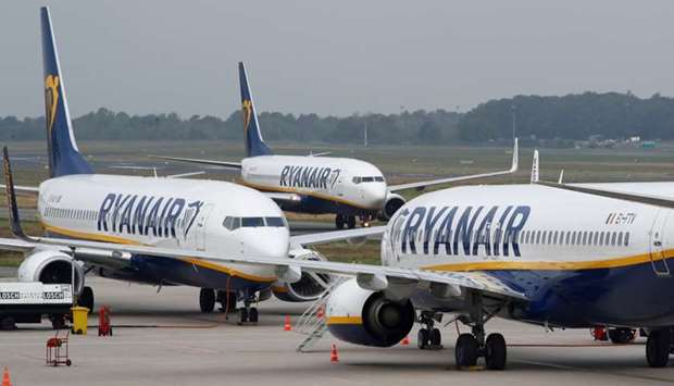 A Ryanair airplane taxis past two parked aircraft at Weeze Airport, near the German-Dutch border, during a strike of Ryanair airline crews in Weeze, Germany. September 12, 2018 file picture. Reuters