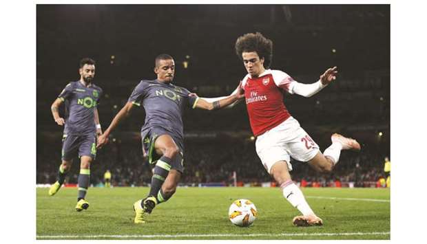 Sporting Lisbonu2019s Portuguese forward Carlos Mane (L) vies with Arsenalu2019s French midfielder Matteo Guendouzi during their UEFA Europa League group stage match in London on Thursday.