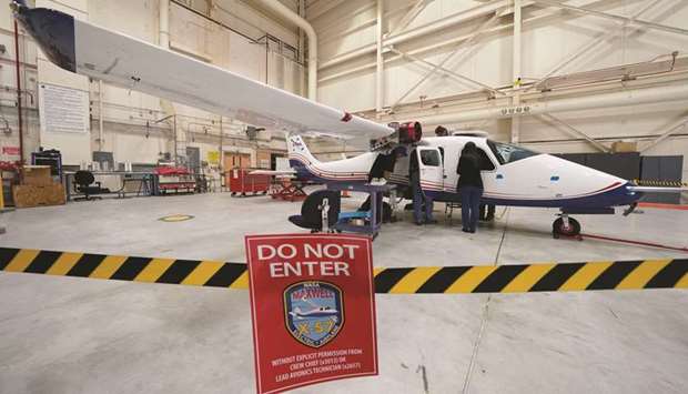 Technicians work on Nasau2019s first all-electric plane, the X-57 Maxwell, at Edwards Air Force Base in California.