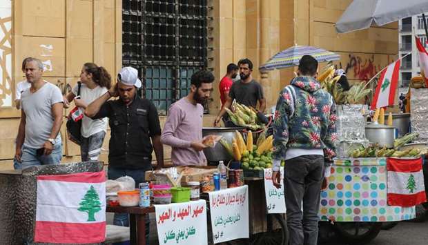 Street vendors sell food to protesters during an-anti government demonstration in downtown Beirut.