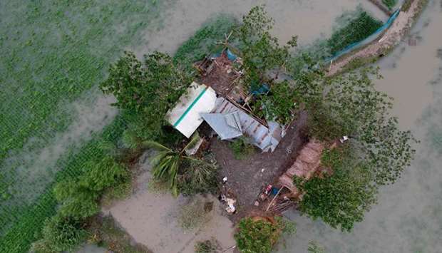 An aerial photo taken today shows a destroyed house after cyclone Bulbul hit the area in Koyra, some 100 km from Khulna.