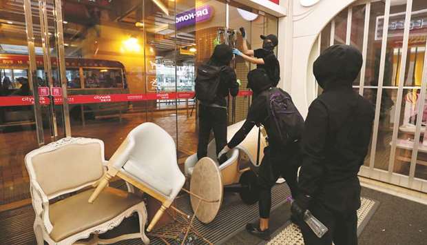 Protesters vandalise a shopping mall during an anti-government demonstration in Tsuen Wan in Hong Kong.