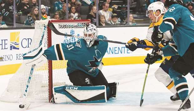 San Jose Sharks goaltender Martin Jones (left) deflects a shot during the NHL game against the Nashville Predators in San Jose, United States, on Saturday. (USA TODAY Sports)
