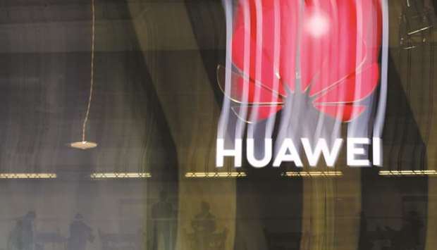 In this file photo taken on October 15, an illuminated Huawei sign is on display during the 10th Global mobile broadband forum hosted by Huawei in Zurich. The US government argues that Huaweiu2019s 5G equipment could undermine global security.
