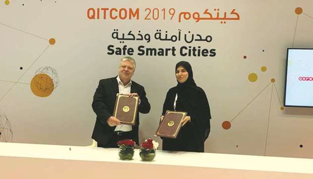 MoTCu2019s engineer Nora Yousef al-Abdulla and TUViTu2019s Frank Beuting at the signing ceremony yesterday.