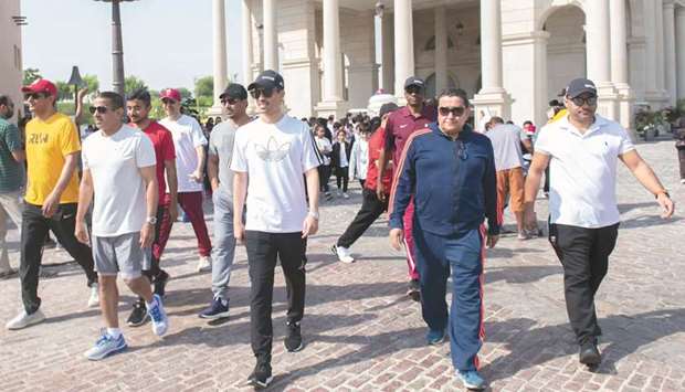 Secretary-General of QOC Jassim Rashid al-Buainain and others taking part in the World Walking Day yesterday.