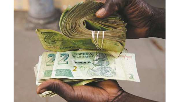 A street vendor displays bond notes before the introduction of new currency in Harare yesterday.