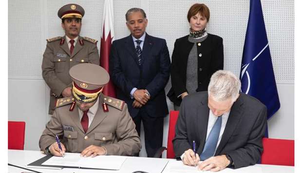 President of the International Military Cooperation Authority Brigadier General Abdulaziz Saleh Al Sulaiti and Director of NATO Office of Security and Deputy Assistant of NATO's Secretary-General of Security Donald Gonneville sign the agreement in the presence of HE Ambassador of the State of Qatar to the Kingdom of Belgium Abdulrahman bin Mohammed Al Khulaifi, Qatari Military Attache to Belgium and NATO Brigadier General Abdul Hadi bin Mubarak Al Hajri