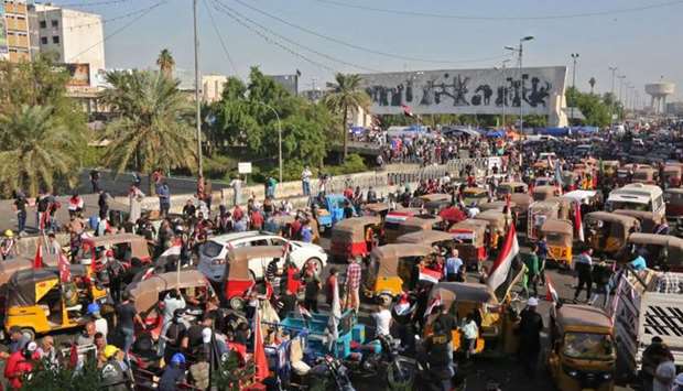Iraqi protesters gather at Tahrir square during ongoing anti-government demonstrations in the capital Baghdad
