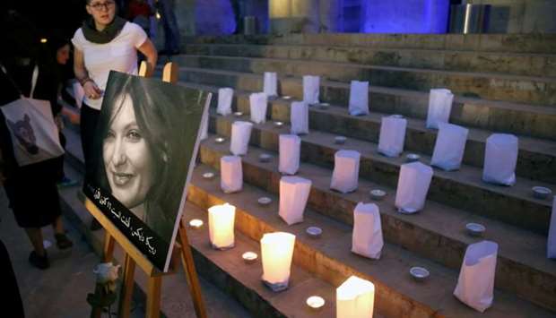 A photo of the British embassy worker, Rebecca Dykes, is seen during a candlelight sit-in organised by activists in Beirut, Lebanon
