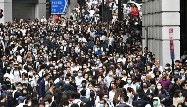 Office workers join pro-democracy protesters during a demonstration in Central in Hong Kong