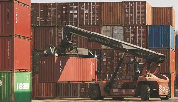 A straddle carrier moves a container at the Uiwang Inland Container Depot in Uiwang, South Korea. The countryu2019s exports dropped for an 11th consecutive month and by 14.7% in October from a year earlier, the data showed, the biggest decline since January 2016 and worse than a 13.8% fall tipped in a Reuters survey.