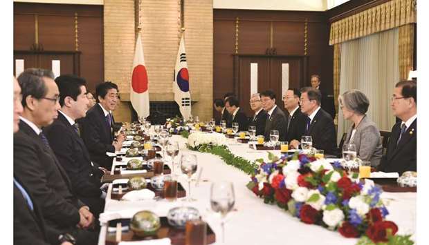 Shinzo Abe, Japanu2019s prime minister (fourth left), speaks during a luncheon with Moon Jae-in, South Koreau2019s president (third right), during a bilateral summit in Tokyo. Southeast Asian leaders will race to get a sprawling China-backed trade pact over the line at a regional meeting in Thailand this weekend, as Beijingu2019s bruising trade war with Washington rumbles on.
