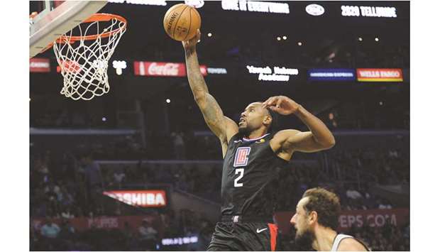 LA Clippersu2019 Kawhi Leonard (left) moves in to score a basket against the San Antonio Spurs during the NBA game in Los Angeles, United States, on Thursday. (USA TODAY Sports)