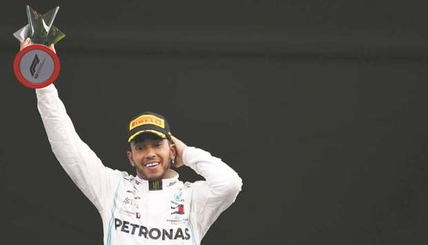 Lewis Hamilton celebrates on the podium after winning the F1 Mexico Grand Prix at the Hermanos Rodriguez racetrack in Mexico City on October 27, 2019. (AFP)