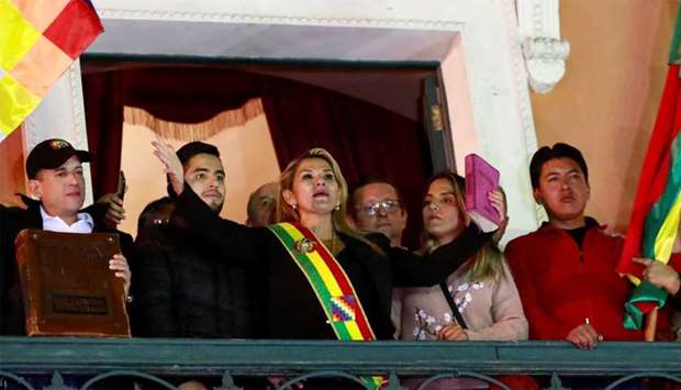 Bolivian Senator Jeanine Anez gestures after she declared herself as Interim President of Bolivia, at the balcony of the Presidential Palace, in La Paz