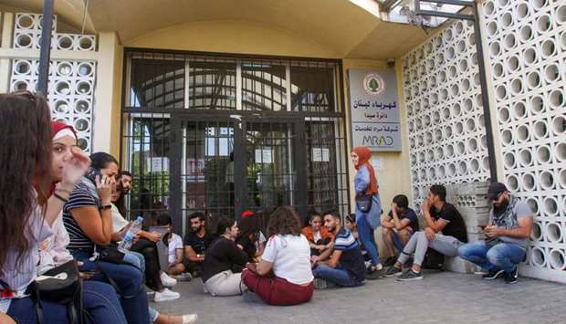 Lebanese demonstrators block the entrance of the Electricity company in the southern city of Sidon (Saida) yesterday.