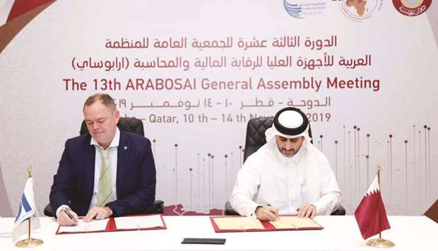 HE the President of the State Audit Bureau Sheikh Bandar bin Mohamed bin Saud al-Thani and Director-General of the INTOSAI Development Initiative Einar Gorrissen signing the agreement yesterday in Doha.