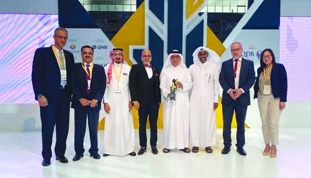 Middle East Modified Bitumen Company, a Doha Bank-financed SME under Qatar Development Banku2019s Al Dhameen Scheme, was honoured at the u2018Qatar Entrepreneurship Rowad Awardu2019 ceremony in Doha recently. Seen are company's officials with Dr Seetharaman.
