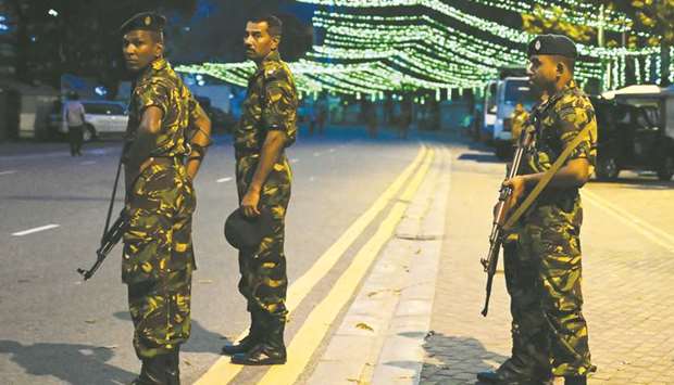 Special Task Force (STF) soldiers stand guard during a final campaign rally of New Democratic Front (NDF) presidential candidate Sajith Premadasa in Colombo yesterday, ahead of the November 16 presidential election.