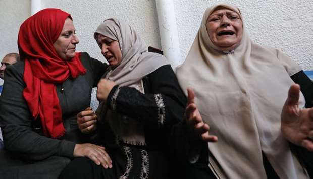 Palestinian relatives of Islamic Jihad fighter Abdullah al-Belbasi mourn during his funeral in Beit Hanun in the northern Gaza Strip.