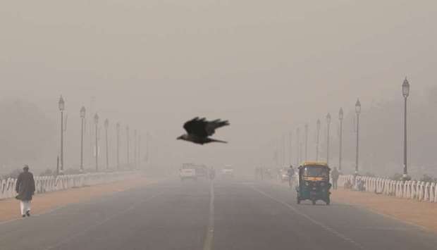 A bird flies amidst smog near the Presidential Palace in New Delhi yesterday.