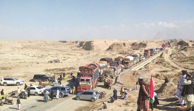 Vehicles are seen after they were stopped on a highway linking the countryu2019s southwest region with Afghanistan, during the second phase of so-called Azadi March (Freedom March), called by the JUI-F to protest against the government, in Qilla Abdullah near Quetta yesterday.