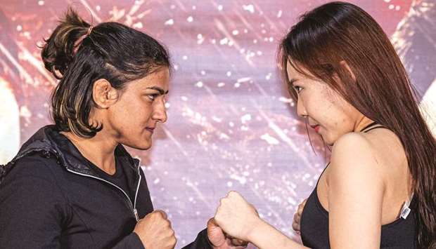 Indiau2019s Ritu Phogat and South Koreau2019s Kim Nam-hee face off ahead of their One Championship: Age of Dragons mixed martial arts bout, which will take place on Saturday, at the Fighting Bros Club, in Beijing.