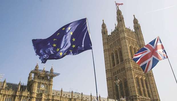 A European Union flag flies alongside a British Union flag, also known as a Union Jack in London (file).
