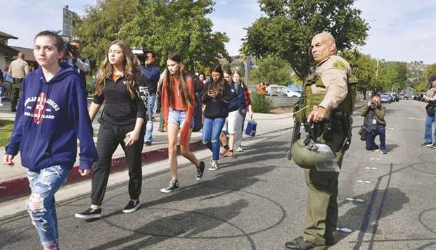 Students line up for evacuation after a shooting at Saugus High School in Santa Clarita, California.