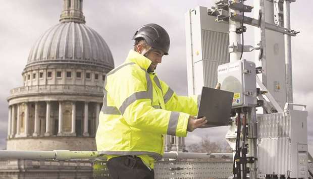 An engineer from EE, the wireless network provider owned by BT Group, checks 5G masts in London. Labour leader Jeremy Corbyn said he would bring the parts of BT that deal with broadband into public ownership as part of a sweeping programme of nationalisations.