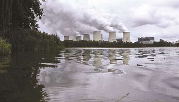 Air pollution rises from cooling towers at a lignite-fired power plant in Germany (file). While Chancellor Angela Merkel is moving to phase out the most polluting fossil fuels, emissions in Germany have actually risen in recent years as the government took nuclear plants off the grid, boosting the need for coal.