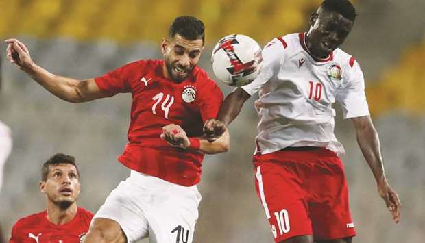 Egyptu2019s Amr Soleya (left) and Kenyau2019s Eric Johana Omondi vie for the ball during the African Nations Cup 2021 Qualifier at the Borg El Arab Stadium in Alexandria, Egypt. (Reuters)