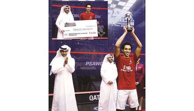 Tarek Momen lifts the World Championship trophy as Qatar Tennis, Squash and Badminton Federation President Nasser al-Kheleifi and General Secretary Tariq Zainal look on at the Khalifa Tennis and Squash Complex yesterday. Inset: Momen collects his cheque from Zainal. PICTURES: Jayan Orma