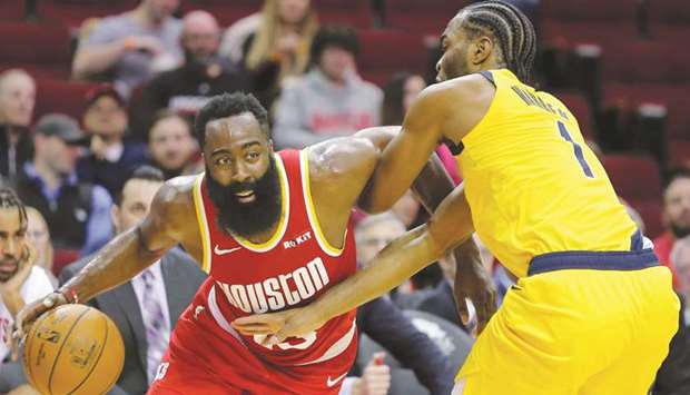 Houston Rockets guard James Harden (left) drives to the basket while Indiana Pacers forward TJ Warren defends at the Toyota Center. PICTURE: USA TODAY Sports