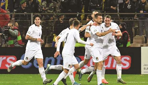 Players of Italian national soccer team celebrate after scoring against Bosnia and Herzegovina in Zenica on Friday.