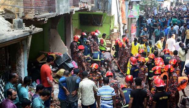 Rescue workers are seen at the site of a gas pipeline explosion in the port city of Chittagong