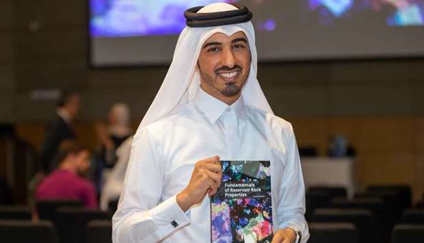 Dr Nayef Alyafei with the book.