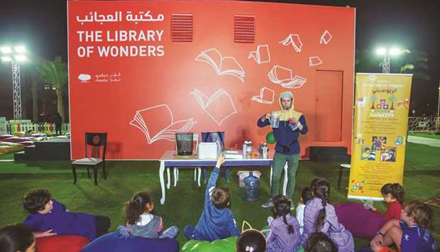 Children interact with a host during a session of activities at Doha Learning Days.