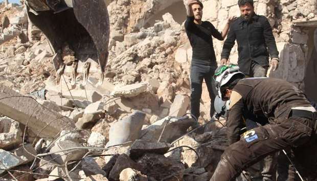 Syrian Civil Defence, also known as the ,White Helmets,, rescue from the rubble a body of a person killed in a reported air strike in the village of al-Malajah in the south of Syria's northwestern Idlib province