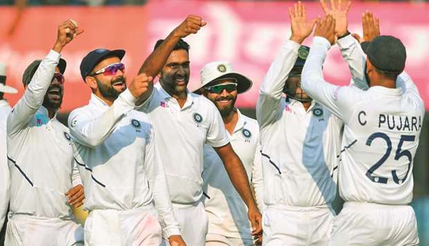 Team India celebrate a wicket during the first Test match against Bangladesh at Holkar Cricket Stadium in Indore on Saturday. (AFP)