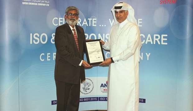 Al-Kuwari (right) receiving the ISO, Responsible Care certifications from Mani.