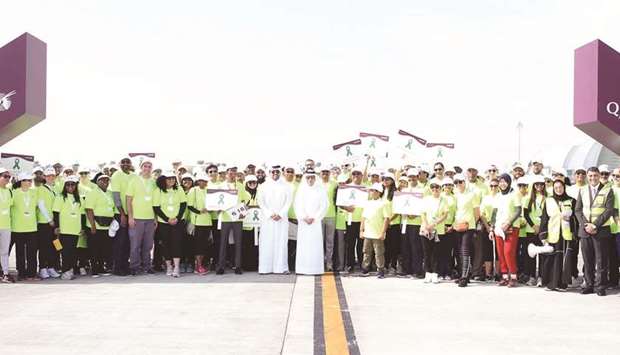 HE Akbar al-Baker with Badr Mohamed al-Meer and the participants at the start of the walk.