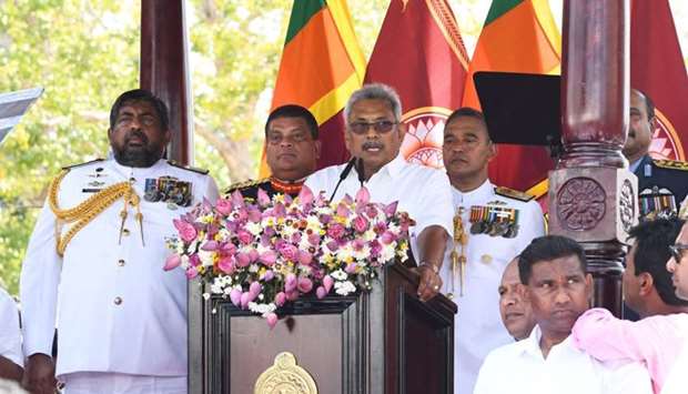 Sri Lanka's new president Gotabaya Rajapaksa (C) speaks during his swearing-in ceremony at the Ruwanwelisaya temple in Anuradhapura