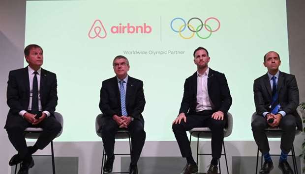 (L-R) International Olympic Committee (IOC) Managing Director Timo Lumme, IOC President Thomas Bach, Airbnb co-founder Joe Gebbia and Airbnb Senior Vice President of Communications Chris Lehane take part in an event in London to announce Airbnb as a leading partner of the Olympics