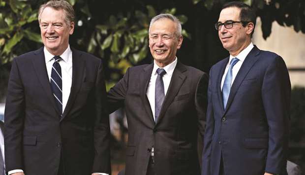 Liu He, Chinau2019s Vice Premier (centre), stands with Robert Lighthizer, US Trade Representative (left), and Steven Mnuchin, US Treasury Secretary,  while arriving for a meeting at the Office of the US Trade Representative in Washington, DC, on October 10. Liu spoke with Mnuchin and Lighthizer by phone on Saturday morning Beijing time, according to the Chinese Commerce Ministry.