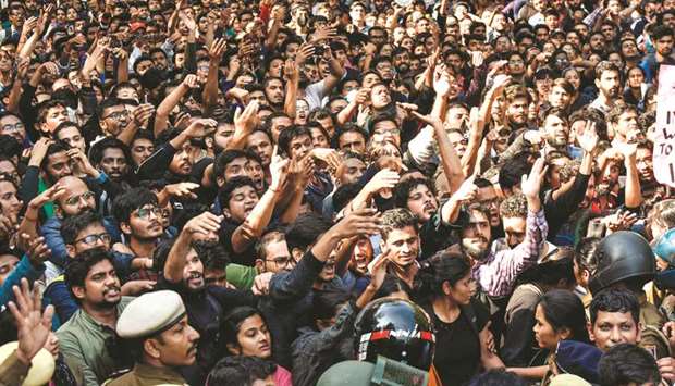 Jawaharlal Nehru University students shout slogans as they protest against hostel fee hike in New Delhi yesterday.