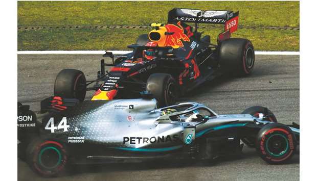 Mercedesu2019 Lewis Hamilton crashes Red Bullu2019s Alexander Albon off the track during the Brazil Grand Prix at the Interlagos racetrack in Sao Paulo, Brazil, on Sunday. (AFP)